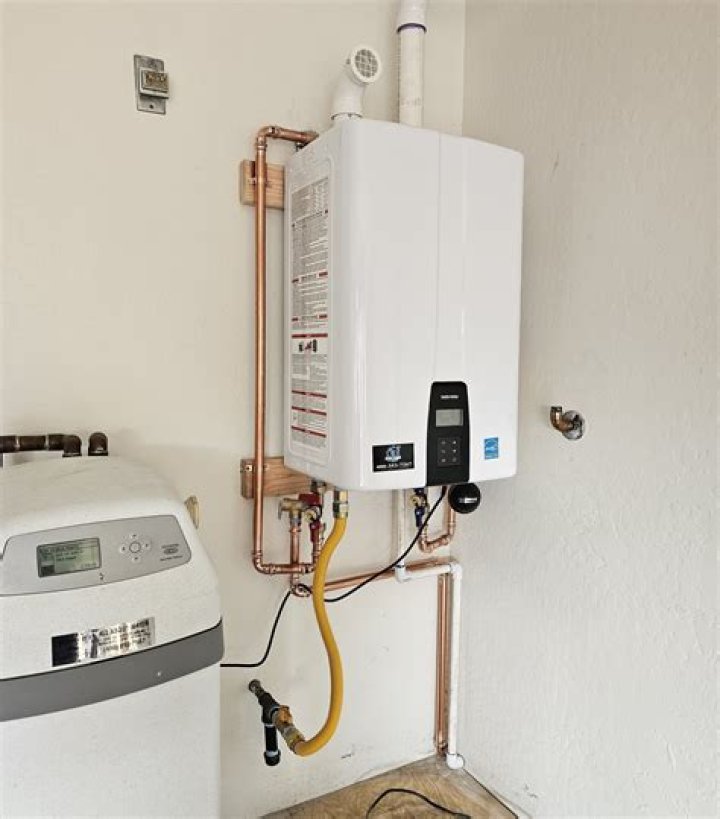 Can a tankless water heater be installed in a laundry room?