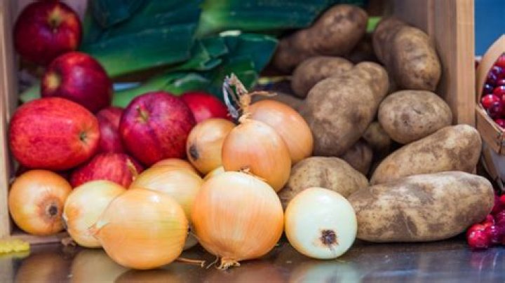 Can onions and potatoes be stored near each other?