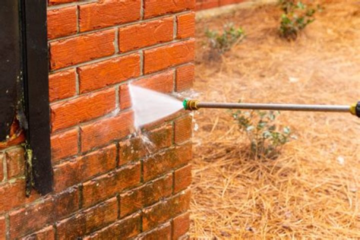 Does pressure washing damage brick?