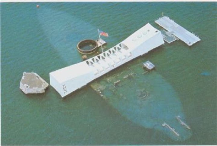 How deep is the water where the USS Arizona sunk?
