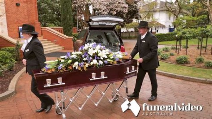 How do funeral directors close the mouth?