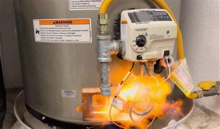 How do I fix the orange flame on my water heater?