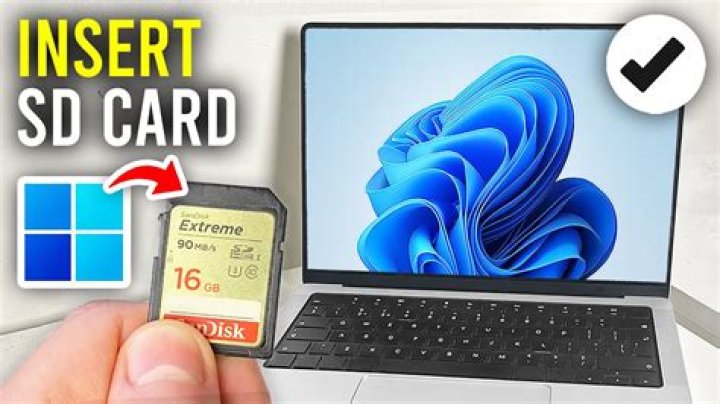 How do I insert an SD card into my laptop?