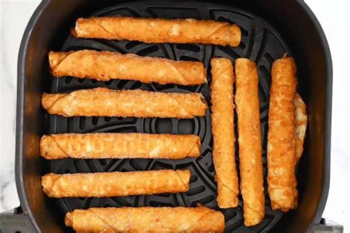 How do you cook frozen taquitos in Ninja Foodi?