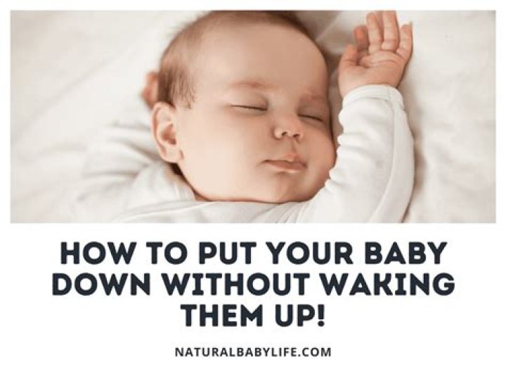 How do you put a newborn down without waking them?