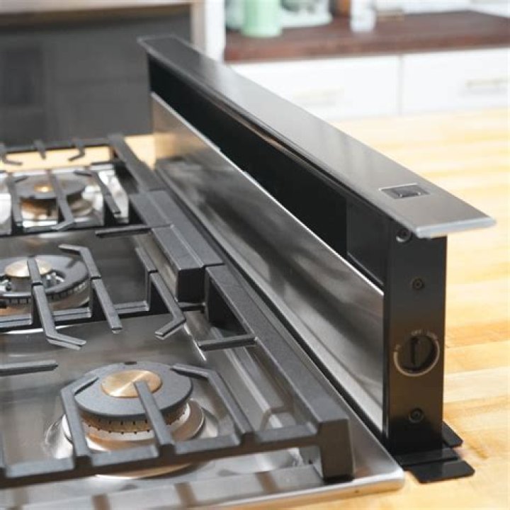 How does a downdraft stove top work?