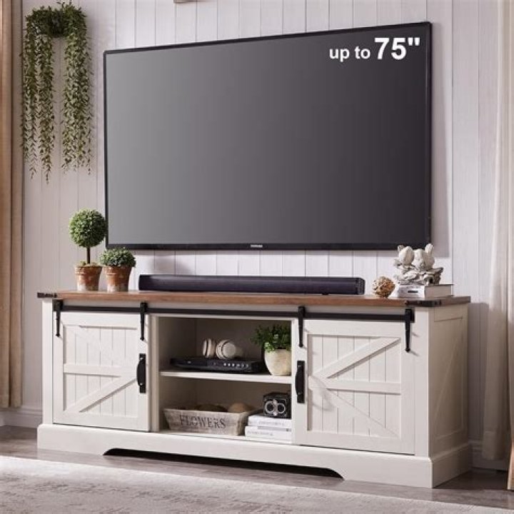 How long does a TV stand need to be for a 55 inch TV?
