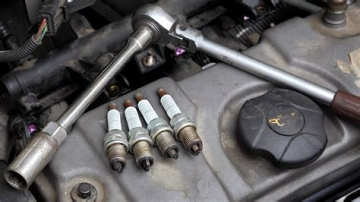 How long does it take for an engine to cool down to change spark plugs?