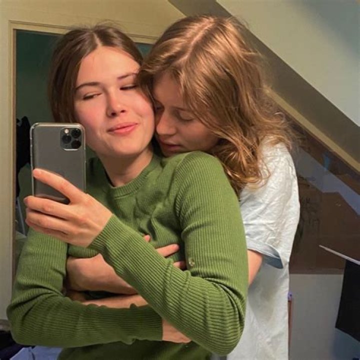 How old is girl in red?