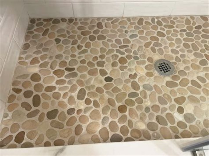 Is it OK to use sanded grout in a shower?