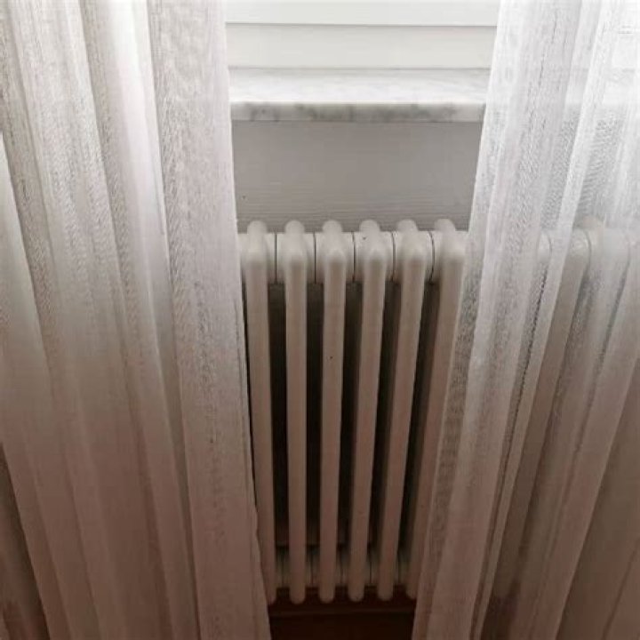 Is it safe to have curtains over radiators?