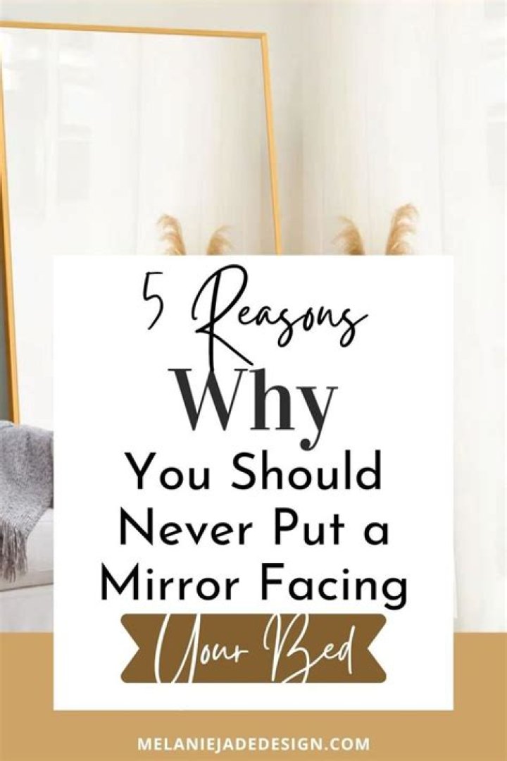 Should a mirror face a bed?