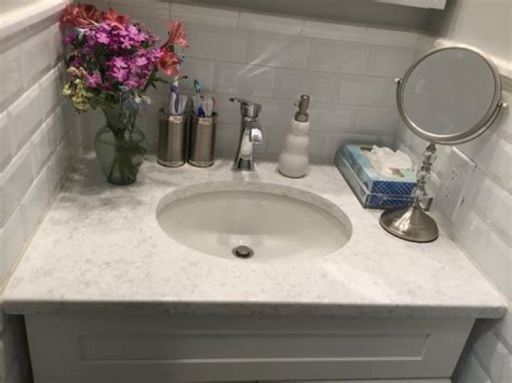 Should I tile around bathroom sink?