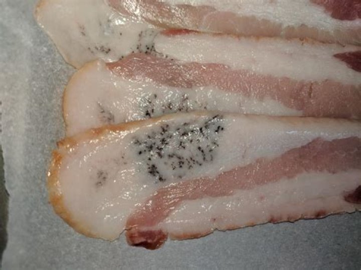 What are black spots on bacon?