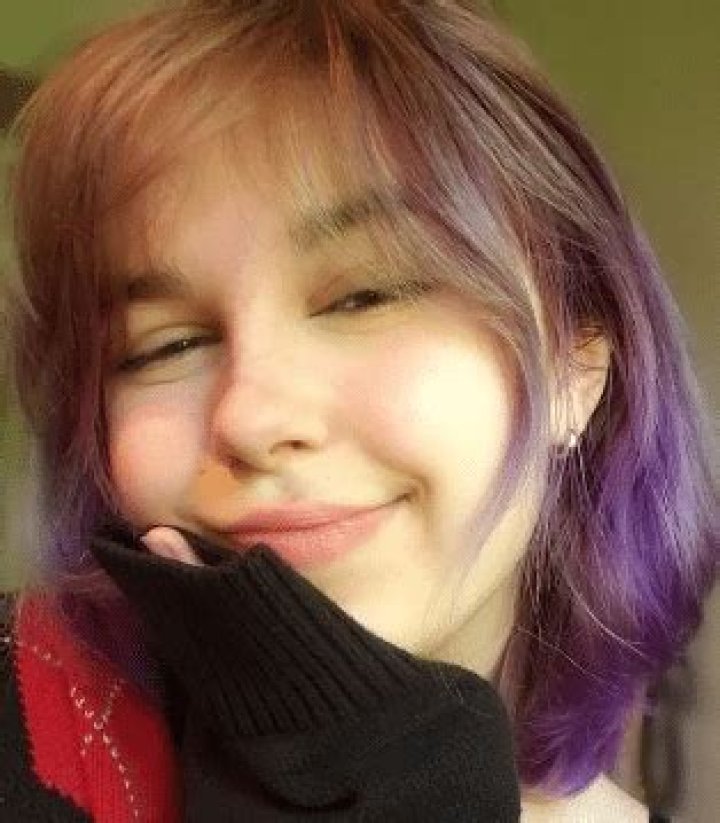 What color does purple fade to in brown hair?