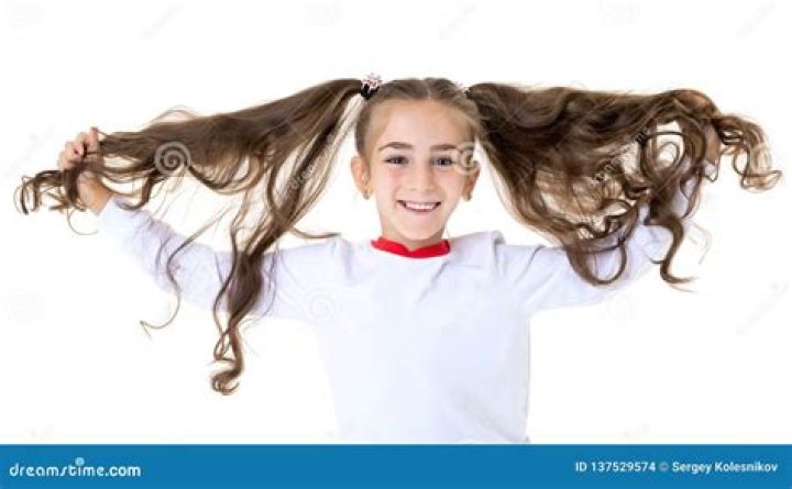 What does it mean when a girl fixes her hair in front of you?