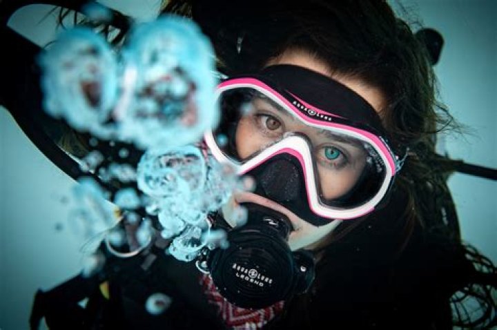 What happens if you start coughing while scuba diving?