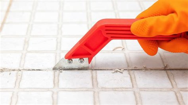 What tool removes grout?