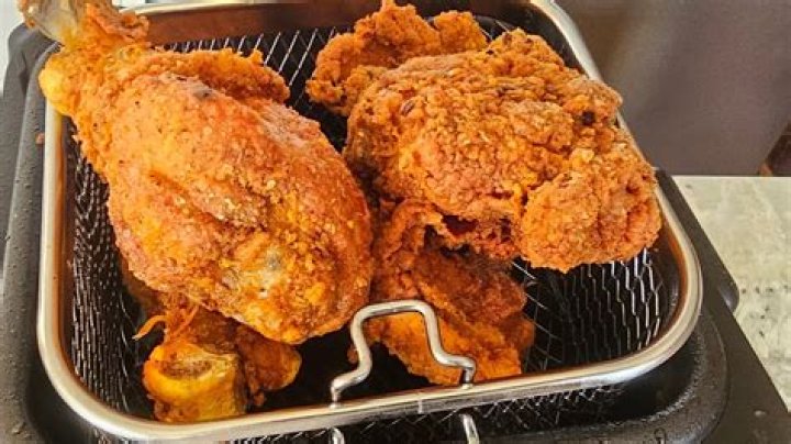 When should you flip chicken when frying?