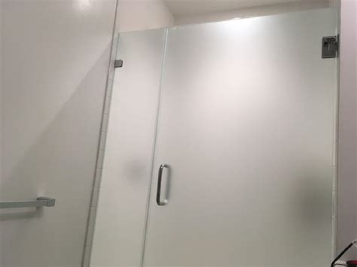 Which way should a shower door open?