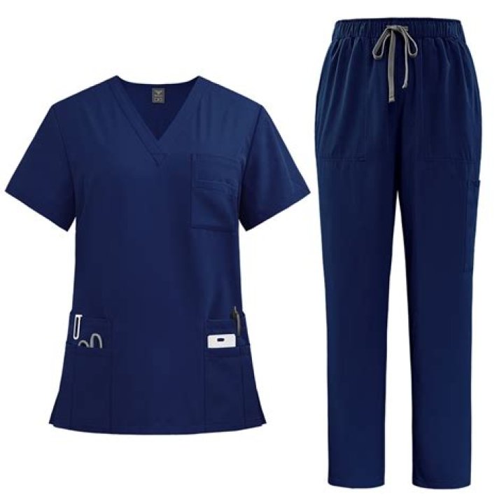 Who wears dark blue scrubs?
