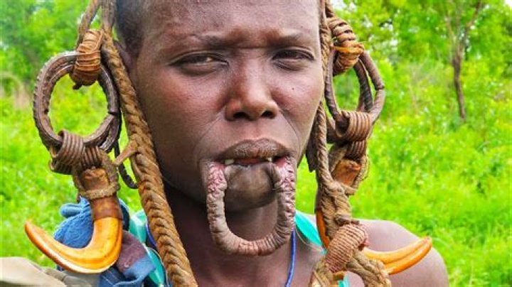 Why do African tribes stretch their ears?