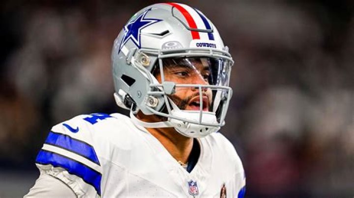 Why do Cowboys wear red stripe helmets?