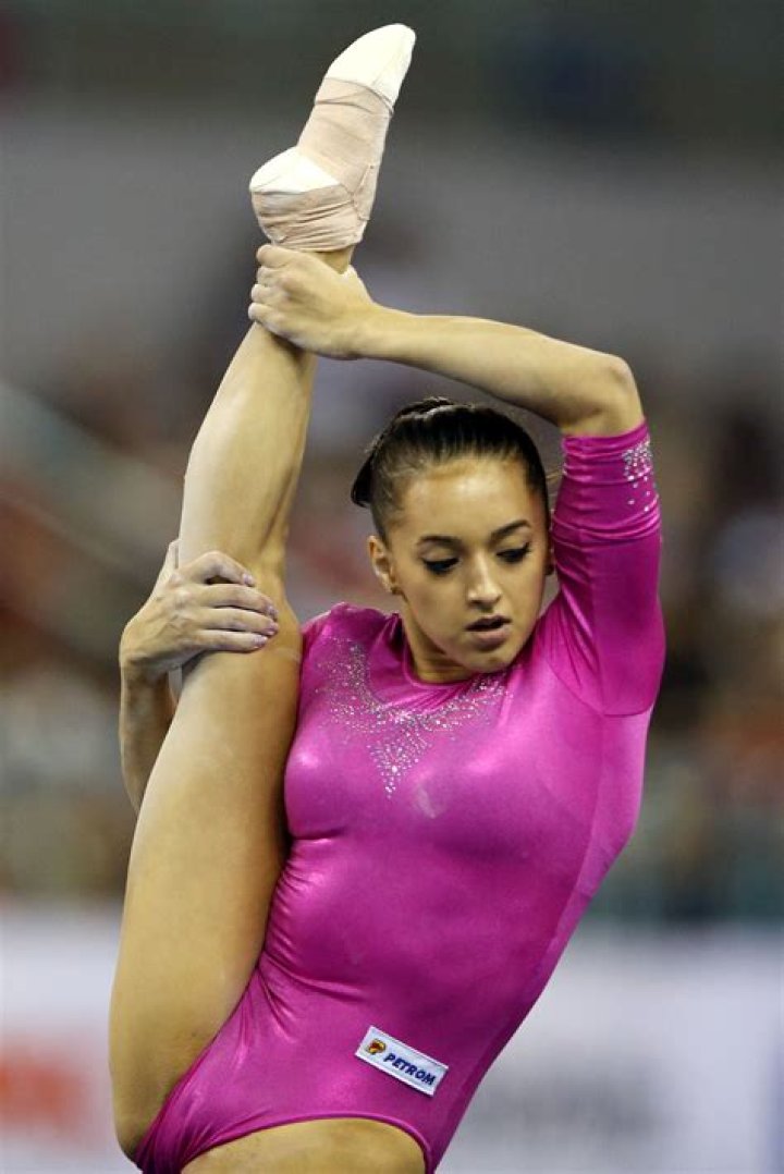 Why do female gymnasts have small chests?