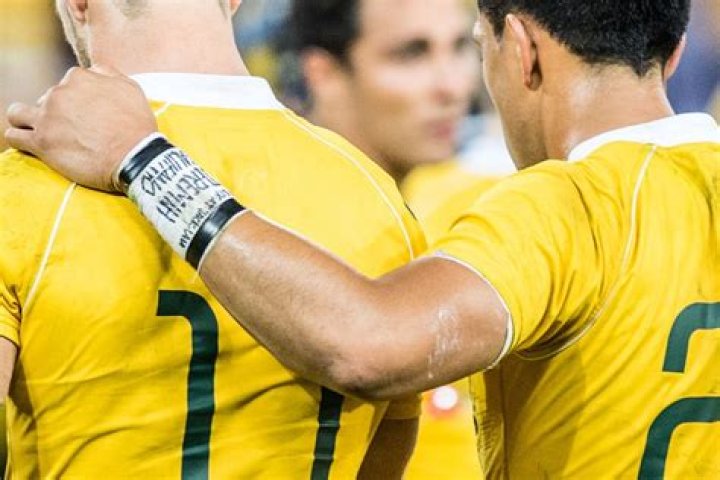 Why do football players wear bands on their arms?