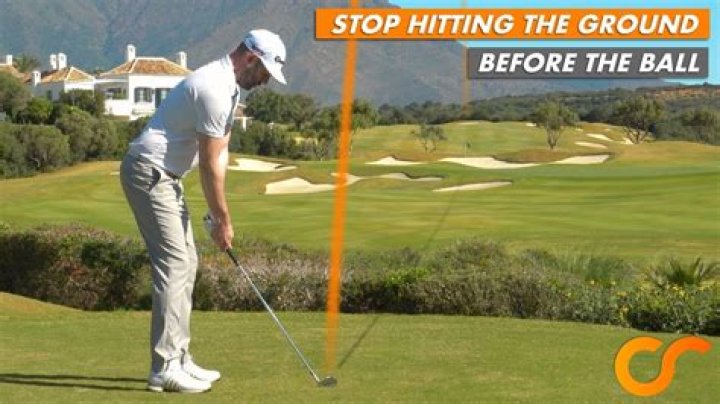 Why do I hit the ground before the ball when chipping?