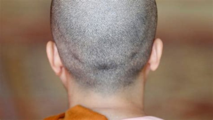 Why do monks shave their heads?