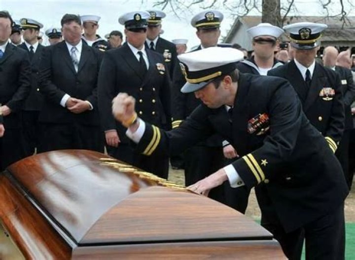 Why do Navy SEALs hit the coffin?
