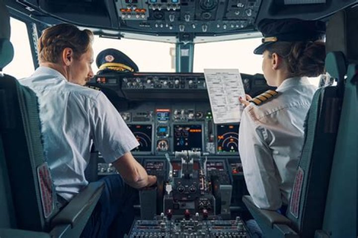 Why do pilots cross their arms?