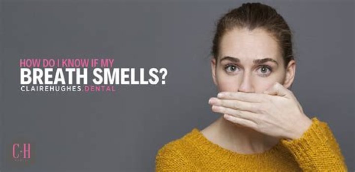 Why does my breath smell when I floss?