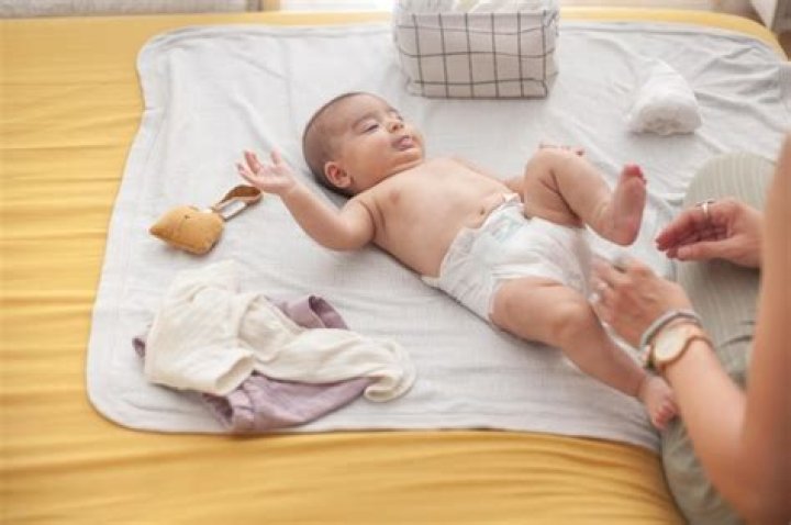 Why does my newborn scream when I change his diaper?