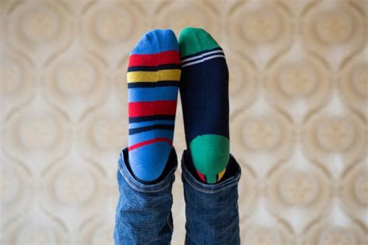 Why does Reid wear mismatched socks?